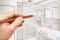 An image of a lady calculating her budget for bathroom renovation.